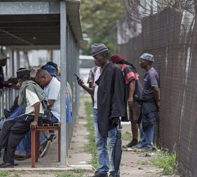 South Africa: Families anxiously wait outside underground mine protest