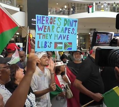 South Africa legal giants return from The Hague to heroes welcome