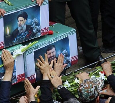 Thousands of Iranians surround late president’s coffin as 5-day mourning starts