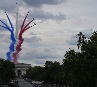 France’s Bastille Day parade meets the Olympic torch relay
