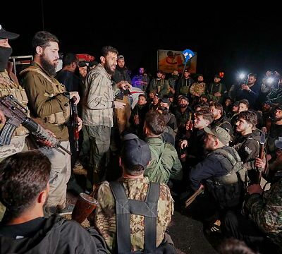 Syrian security forces and Druze gunman deploy in a Damascus suburb