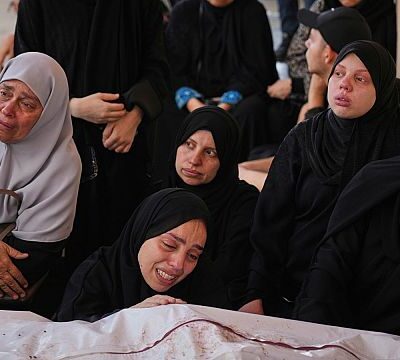Palestinians mourn the 11 victims of an attack in Khan Younis