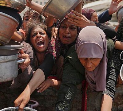 People in Gaza scramble for food aid as the death toll from hunger rises