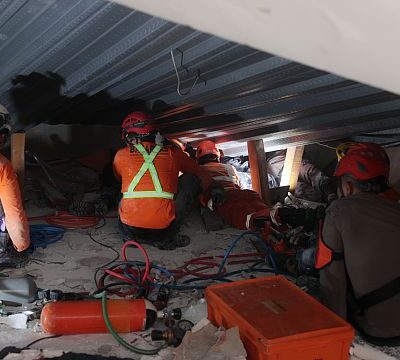 Rescue teams search for survivors after school building collapse in Indonesia