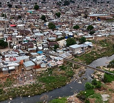Volunteers help clean the polluted Jukskei River “prone” to flash floods
