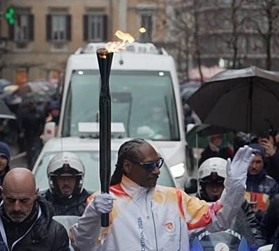 Snoop Dogg surprises Italy by joining Olympic torch relay in Gallarate
