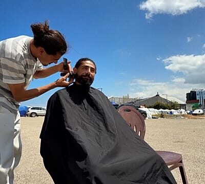 At Beirut shoreline camp, volunteer barber brings dignity with free haircuts