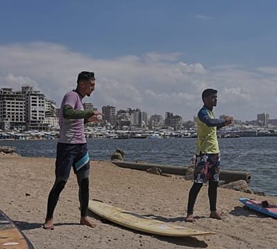 Surfers in war-torn Gaza find rare moments of joy taking to the waves