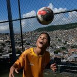 Young footballers in a Rio favela find hope from their sport ahead of World Cup
